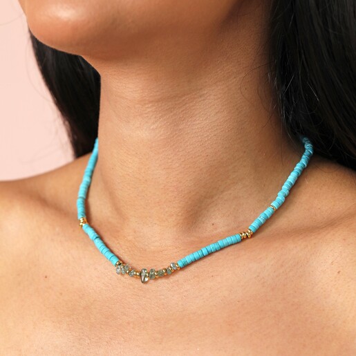close up of the Blue Semi-Precious Heishi Beaded Necklace in Gold on a model