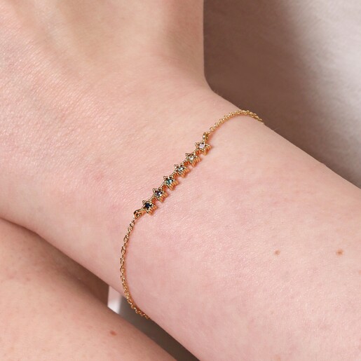 Close up of Blue Ombre Crystal Star Bar Bracelet in Gold on model