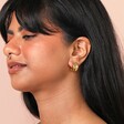 Model shot of the Chunky Organic Hoop Earrings in Gold