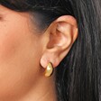 close up of the Chunky Teardrop Half Hoop Earrings in Gold