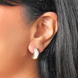 close up of the Chunky Teardrop Half Hoop Earrings in Silver