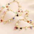 Colourful Semi-Precious Stone Tiny Droplet Necklace in Gold on Beige Background