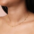 model shot of the Dainty Flower Charm Necklace in Gold