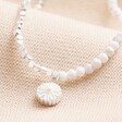 Close Up of Charm on Daisy Charm White & Silver Beaded Necklace
