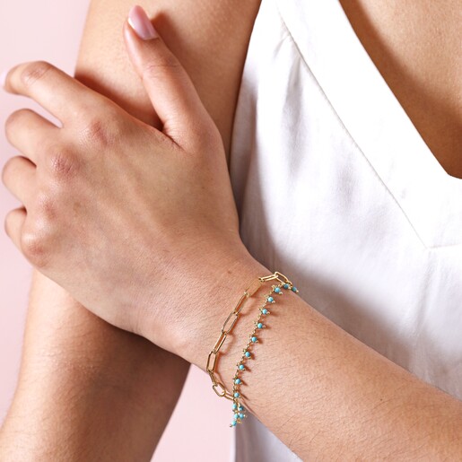 Teal Stone Droplet and Cable Chain Layered Bracelet in Gold on model with hand on arm