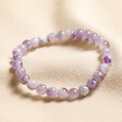 February amethyst Birthstone Semi-Precious Stone Beaded Bracelet against neutral backdrop