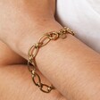 Close up of Gold Stainless Steel Chunky Oval Link Chain Bracelet on Model