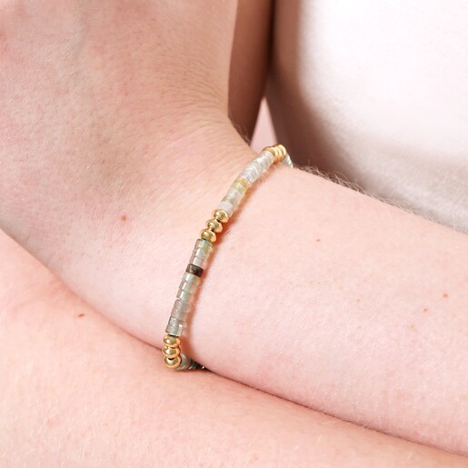 Close up of Green Semi-Precious Stone Heishi Beaded Bracelet in Gold on model