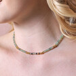 Close up of Green Semi-Precious Stone Heishi Beaded Necklace in Gold on blonde haired model