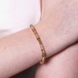 Close up of Mixed Rondelle Stone Beaded Bracelet in Gold on model