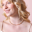 Mixed Rondelle Stone Beaded Necklace in Gold on blonde model smiling