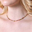 Close up of Mixed Rondelle Stone Beaded Necklace in Gold on blonde haired model