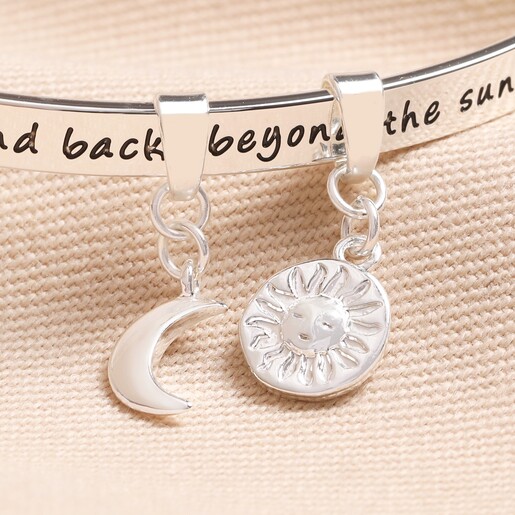 Close Up Close up of charms on Moon and Sun Meaningful Word Bangle in Silver