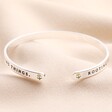 Ends of Rooting For You Meaningful Word Bangle in Silver against beige background