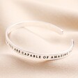 Other side of Rooting For You Meaningful Word Bangle in Silver against neutral backdrop