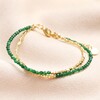 Green Semi-Precious Stone Layered Beaded Bracelet in Gold on Pink Fabric