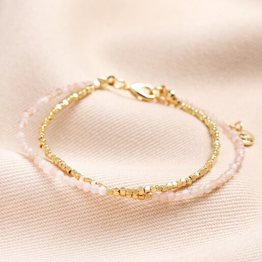 Pink Semi-Precious Stone Layered Beaded Bracelet in Gold on Pink Fabric