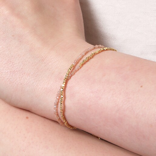 Close Up of Pink Semi-Precious Stone Layered Beaded Bracelet in Gold on Model