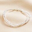 White Semi-Precious Stone Layered Beaded Bracelet in Silver on Beige Fabric