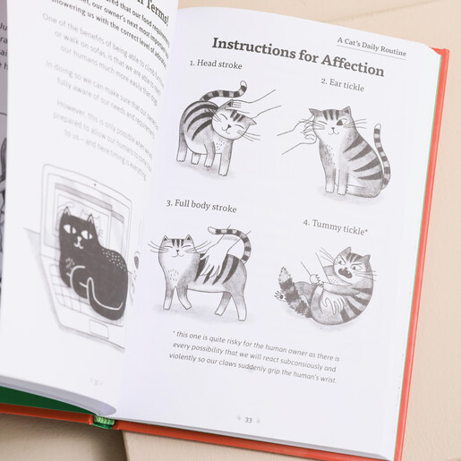 Catology Book open against beige coloured backdrop