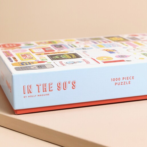 Side of Child of the 90's 1000 Piece Jigsaw Puzzle box against beige coloured backdrop