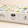 Side of Classic Paperbacks 1000 Piece Jigsaw Puzzle box against beige background