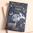 Folk Tales of the Night Book on Pink Surface