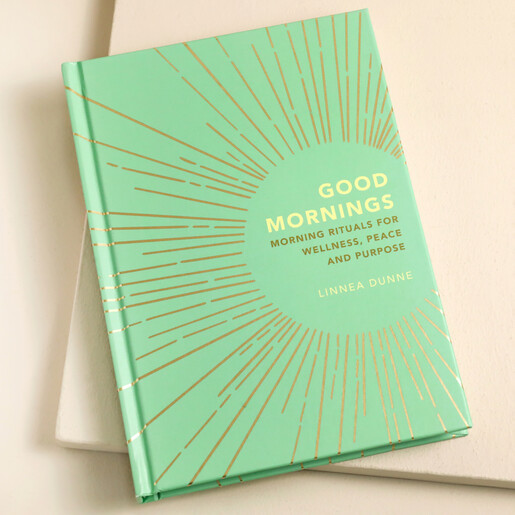 Good Mornings: Morning Rituals for Wellness Book on Beige Surface