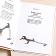 Yoga for Stiff Birds Book open showing poses inside of book