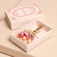 Close Up of Teacher Tiny Matchbox Dried Flower Posy on Beige Background