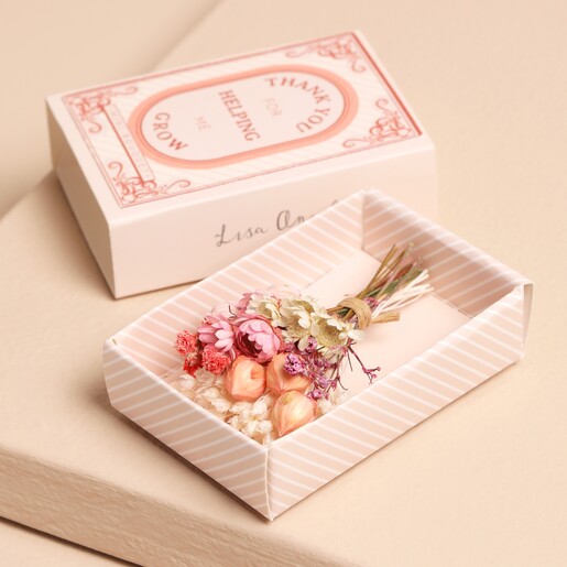 Close Up of Teacher Tiny Matchbox Dried Flower Posy on Beige Background