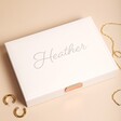 Personalised Stackers Classic Jewellery Box in White closed with jewellery outside of box against beige backdrop