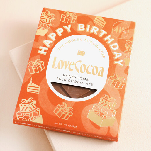 Love Cocoa Happy Birthday Honeycomb Chocolate Bar on top of beige backdrop
