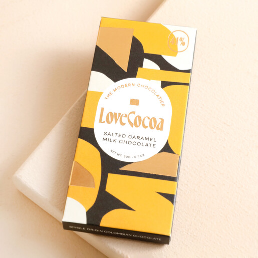 Love Cocoa Mini Salted Caramel 41% Milk Chocolate Bar against beige coloured backdrop