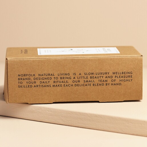 Side of Norfolk Natural Living Set of 3 Hand Creams packaging showing other side against beige backdrop
