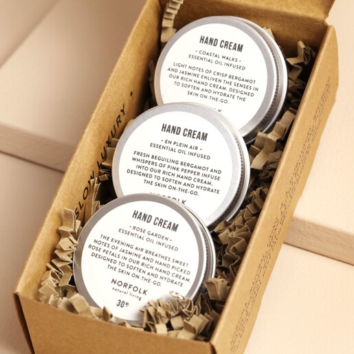 Close up of creams inside of Norfolk Natural Living Set of 3 Hand Creams packaging