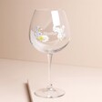 Personalised Floral Bee Gin Glass on Pink Surface