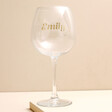 Personalised Gold Name and Constellation Gin Glass against beige coloured background