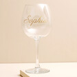 Personalised Gold Name Gin Glass against neutral coloured backdrop