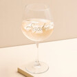 Personalised Gold Name Gin Glass on top of beige backdrop