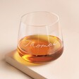 Personalised Script Name Whisky Glass with whisky inside against beige backdrop