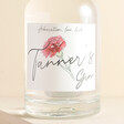 Close up of personalised Birth Flower 500ml Gin against beige coloured background