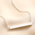 Sterling Silver Horizontal Bar Necklace against neutral fabric