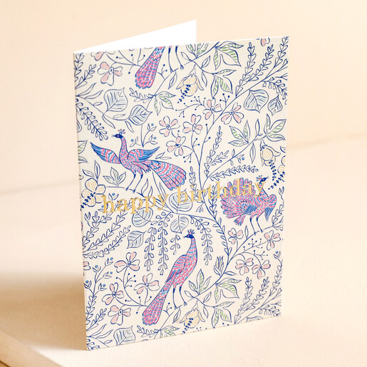 Ohh Deer Peacock Birthday Card standing against beige backdrop