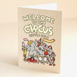 Ohh Deer Welcome to the Circus New Baby Card standing on top of beige backdrop