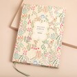 Papier Fairy Flies Wellness Journal on top of beige coloured backdrop