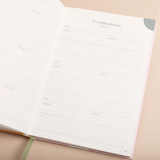 Papier Follow The Sun Travel Journal open on inside pages against neutral backdrop