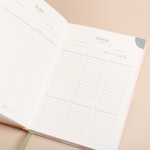 Papier Follow The Sun Travel Journal open showing inside pages against beige backdrop