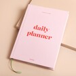 Papier Joy Daily Planner on Pink Surface