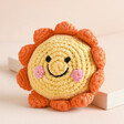 Pebble Friendly Sun Rattle Toy on Neutral Background